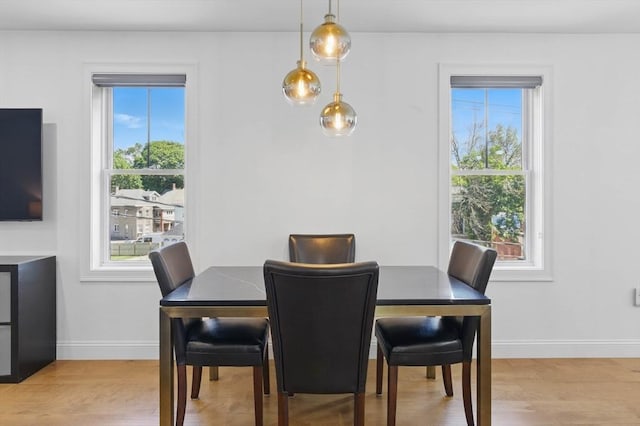 9 Boston St Unit 3, Salem, MA 01970 - dining room featuring light wood-style flooring and baseboards