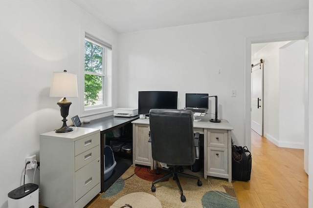 9 Boston St Unit 3, Salem, MA 01970 - office with light wood-type flooring and a barn door