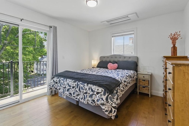 9 Boston St Unit 3, Salem, MA 01970 - bedroom featuring access to outside, multiple windows, hardwood / wood-style flooring, and baseboards