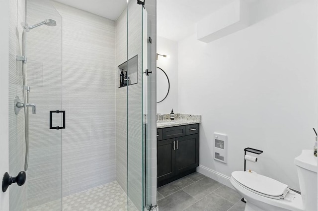 9 Boston St Unit 3, Salem, MA 01970 - bathroom featuring heating unit, toilet, vanity, a shower stall, and baseboards