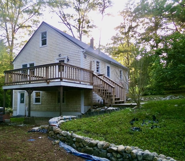 19 Saint Anns Ln, Falmouth, MA 02536 - rear view of property with a deck, a chimney, and stairs