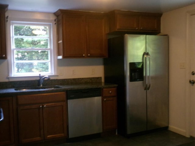 19 Saint Anns Ln, Falmouth, MA 02536 - kitchen featuring stainless steel appliances, dark countertops, and plenty of natural light
