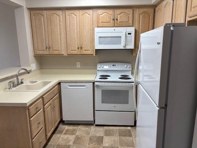 34 Sumner Ave Unit 302, Springfield, MA 01108 - kitchen with white appliances, a sink, light countertops, and light brown cabinets