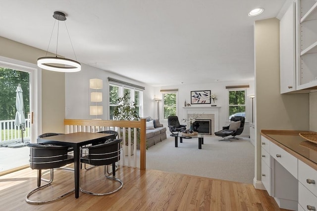 5 Mckinley Dr, Acton, MA 01720 - dining area featuring a high end fireplace, light wood-style flooring, and recessed lighting