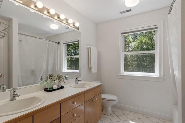 5 Mckinley Dr, Acton, MA 01720 - bathroom featuring double vanity, tile patterned flooring, toilet, and baseboards