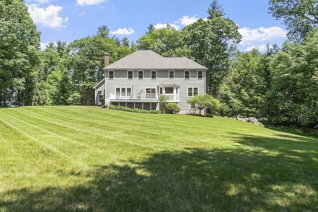 5 Mckinley Dr, Acton, MA 01720 - rear view of house featuring a chimney and a yard