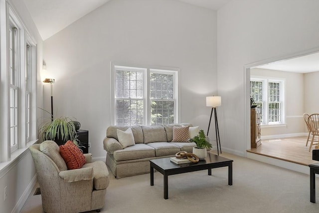5 Mckinley Dr, Acton, MA 01720 - living area featuring high vaulted ceiling, baseboards, and light carpet