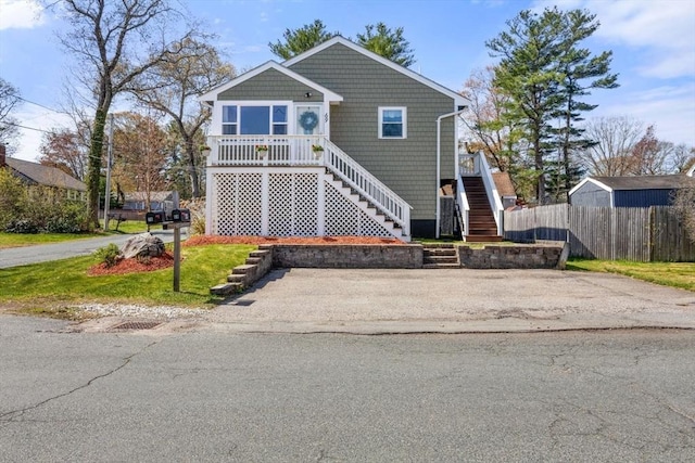 69 W Shore Rd, Holbrook, MA 02343 - view of front facade featuring stairway and fence