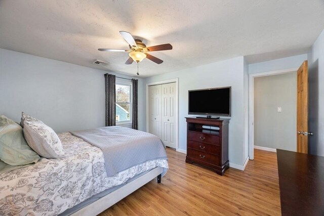 69 W Shore Rd, Holbrook, MA 02343 - bedroom featuring a closet, light wood-style flooring, baseboards, and ceiling fan