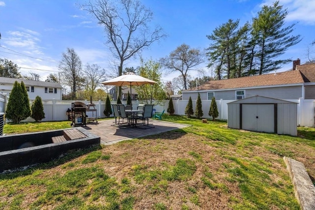 69 W Shore Rd, Holbrook, MA 02343 - view of yard featuring a shed, a patio, and an outdoor structure