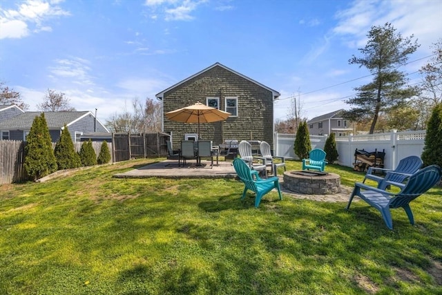 69 W Shore Rd, Holbrook, MA 02343 - back of house with an outdoor fire pit and a patio area