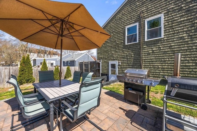69 W Shore Rd, Holbrook, MA 02343 - view of patio with area for grilling, fence, and outdoor dining area