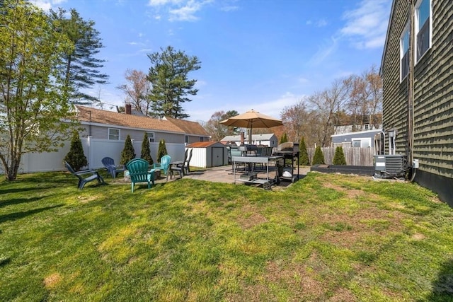 69 W Shore Rd, Holbrook, MA 02343 - view of yard featuring a storage shed, an outdoor structure, central air condition unit, and a patio area