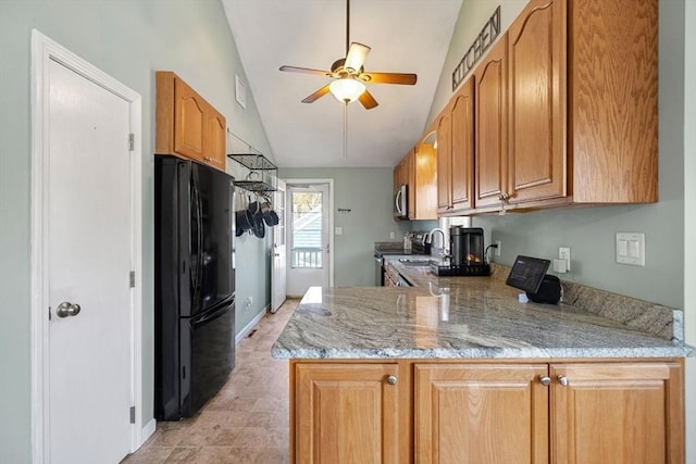 69 W Shore Rd, Holbrook, MA 02343 - kitchen featuring appliances with stainless steel finishes, a ceiling fan, a peninsula, lofted ceiling, and light stone countertops