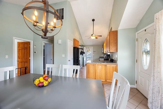 69 W Shore Rd, Holbrook, MA 02343 - dining area featuring light tile patterned floors, a chandelier, a ceiling fan, high vaulted ceiling, and baseboards