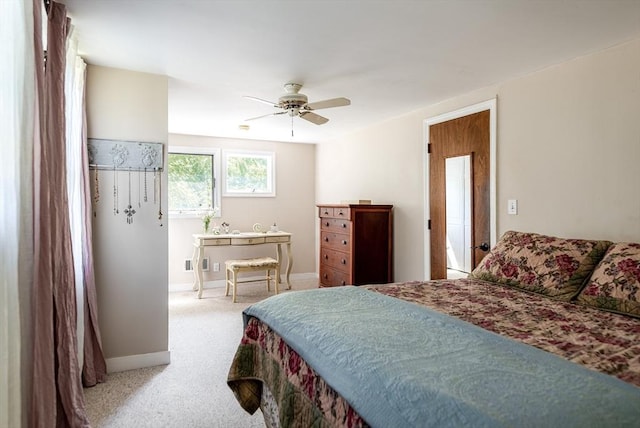bedroom featuring baseboards, carpet flooring, and a ceiling fan