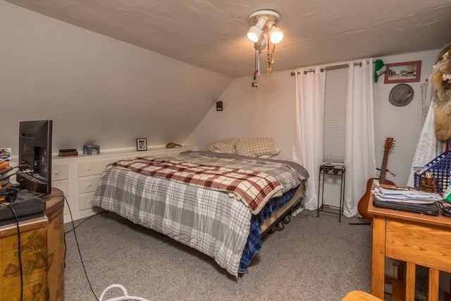 carpeted bedroom featuring vaulted ceiling