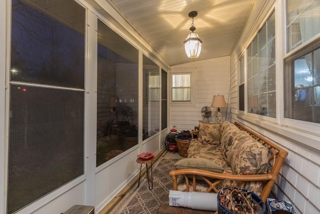 sunroom featuring vaulted ceiling