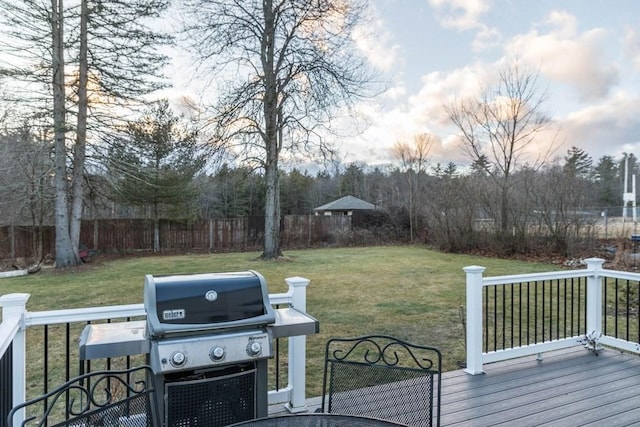 deck with a yard and area for grilling