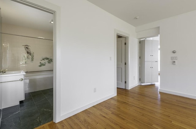 240 Atlantic Rd, Gloucester, MA 01930 - empty room featuring baseboards, wood finished floors, and a smoke detector