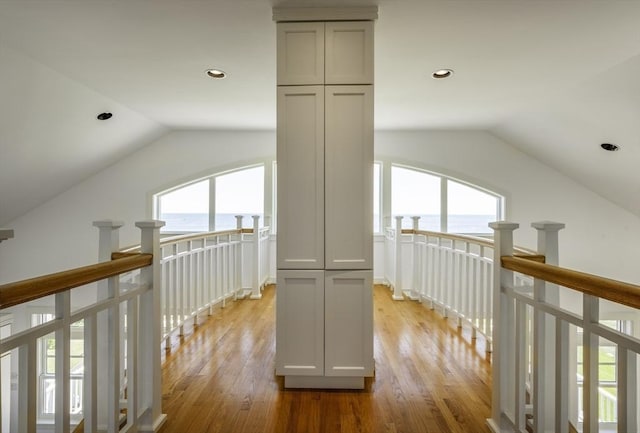 240 Atlantic Rd, Gloucester, MA 01930 - hallway featuring lofted ceiling, a water view, an upstairs landing, light wood-type flooring, and recessed lighting