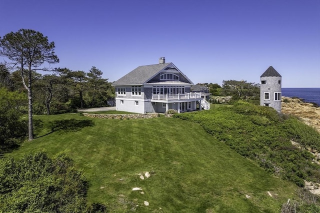 240 Atlantic Rd, Gloucester, MA 01930 - rear view of property with a chimney and a lawn