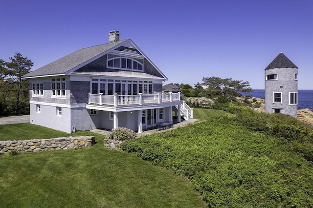 240 Atlantic Rd, Gloucester, MA 01930 - back of property featuring a chimney, a lawn, and a wooden deck