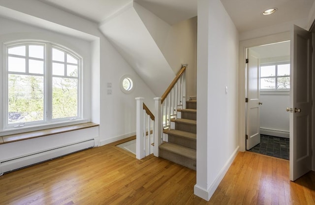 240 Atlantic Rd, Gloucester, MA 01930 - stairway with wood finished floors, baseboard heating, recessed lighting, and baseboards