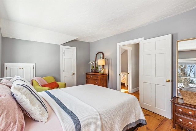 bedroom featuring light wood-style flooring