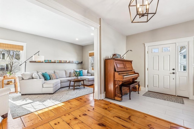 entrance foyer featuring an inviting chandelier, hardwood / wood-style floors, and recessed lighting