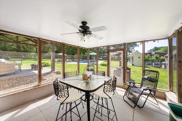 472 Potter Rd, Framingham, MA 01701 - sunroom with ceiling fan and outdoor dining area