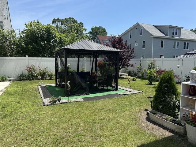 89-91 Cambridge St, Lawrence, MA 01843 - fenced backyard featuring a gazebo and a vegetable garden