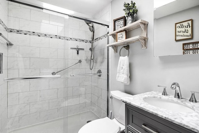 full bath featuring a shower stall, toilet, and vanity