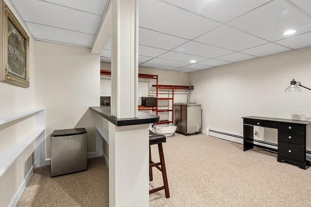 bar with a drop ceiling, freestanding refrigerator, and carpet