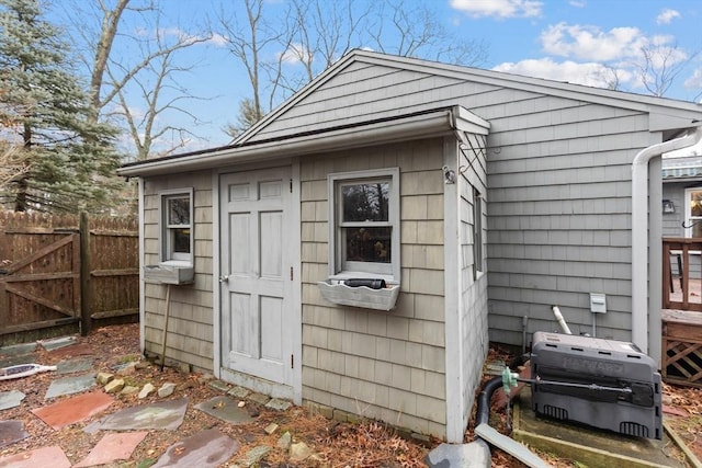 view of outbuilding with an outdoor structure and fence