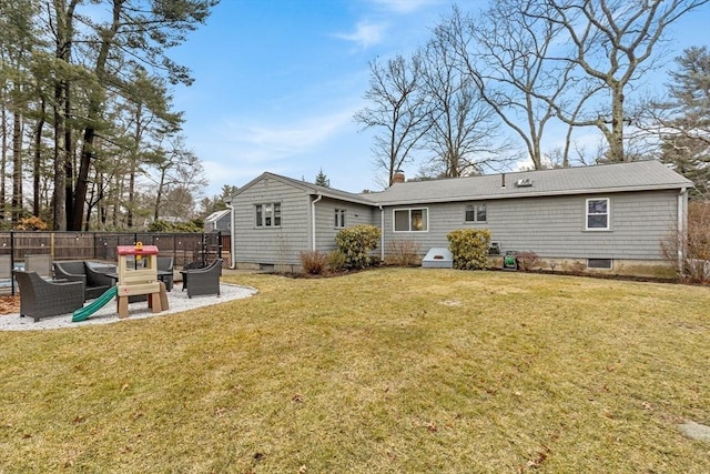 rear view of house featuring a patio area, a lawn, fence, and a chimney