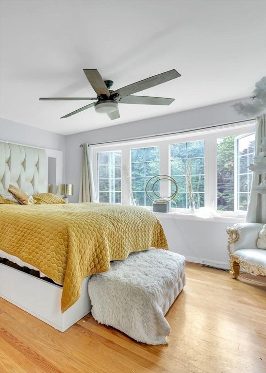 bedroom with hardwood / wood-style flooring and ceiling fan