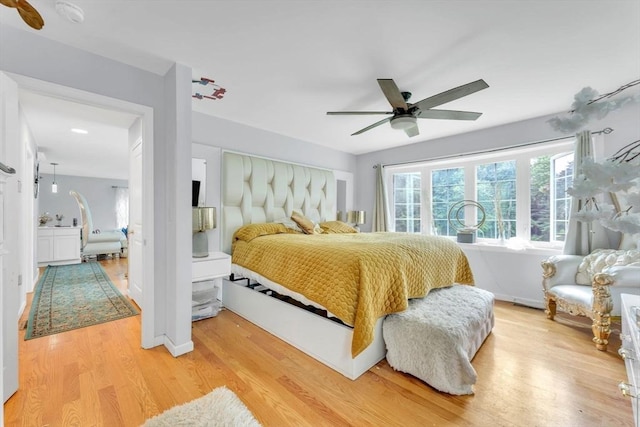 bedroom featuring light hardwood / wood-style floors and ceiling fan