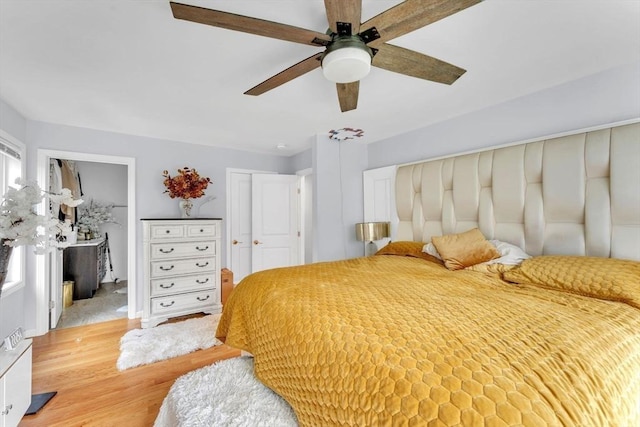 bedroom featuring ceiling fan and light wood-type flooring