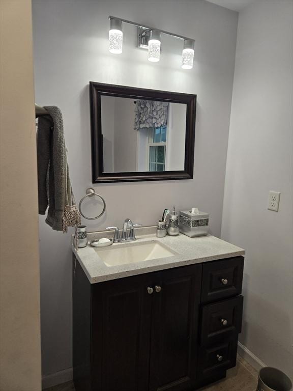 bathroom with tile patterned flooring and vanity