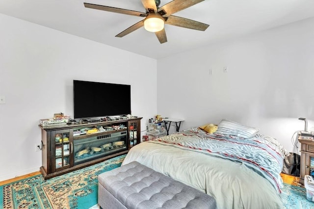 bedroom featuring hardwood / wood-style flooring and ceiling fan