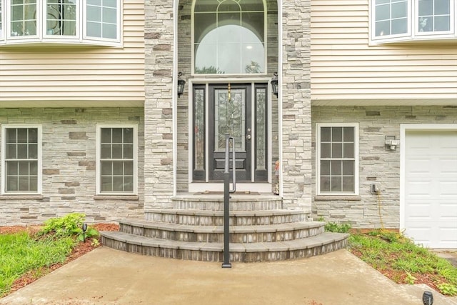 view of exterior entry featuring a garage