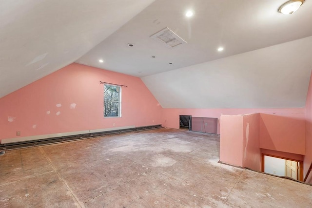 additional living space with baseboard heating and vaulted ceiling