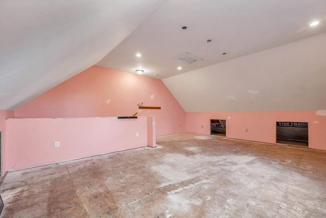 additional living space featuring vaulted ceiling