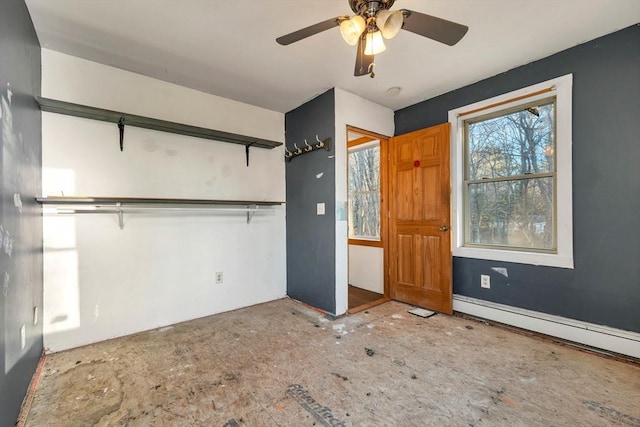 unfurnished bedroom with ceiling fan, a closet, and a baseboard radiator