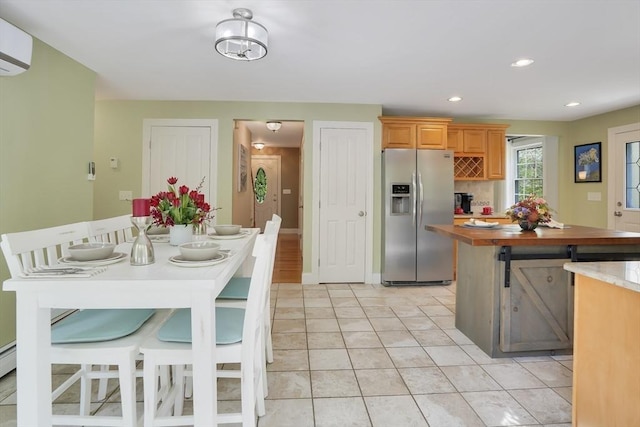 71 Sixth St N, Edgartown, MA 02539 - kitchen featuring stainless steel fridge with ice dispenser, a wall mounted air conditioner, a kitchen island, light tile patterned flooring, and recessed lighting