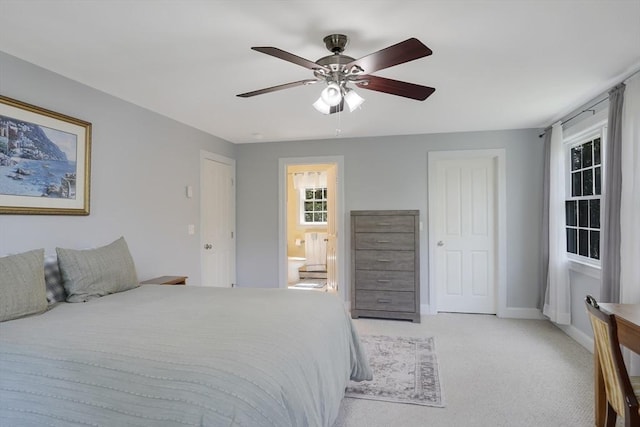 71 Sixth St N, Edgartown, MA 02539 - bedroom with light carpet, ensuite bathroom, ceiling fan, and baseboards