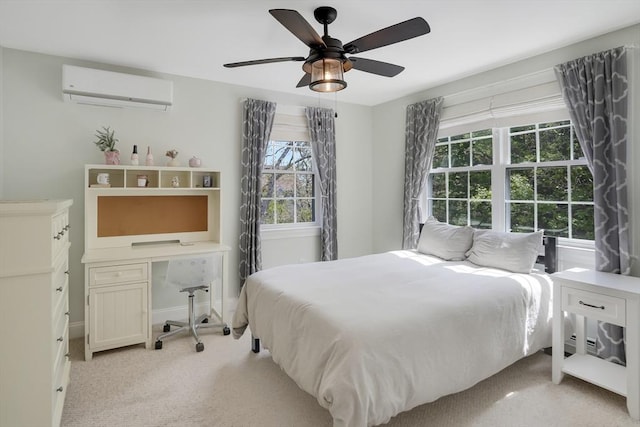 71 Sixth St N, Edgartown, MA 02539 - bedroom with a wall unit AC, light carpet, a ceiling fan, an office area, and baseboards