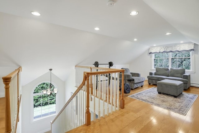 71 Sixth St N, Edgartown, MA 02539 - interior space with an upstairs landing, lofted ceiling, light wood-style floors, recessed lighting, and a baseboard radiator