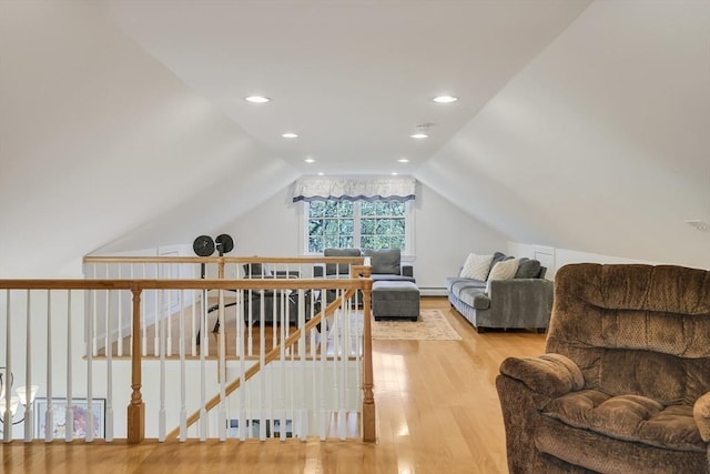 71 Sixth St N, Edgartown, MA 02539 - sitting room featuring wood finished floors, vaulted ceiling, an upstairs landing, a baseboard heating unit, and recessed lighting